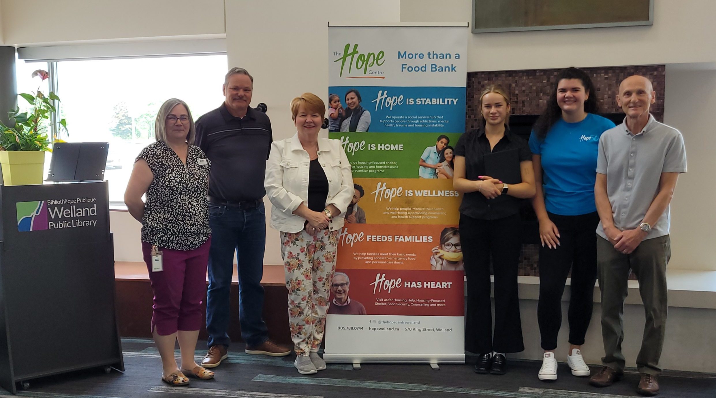 Group photo at the Welland Public Library with The Hope Centre banner