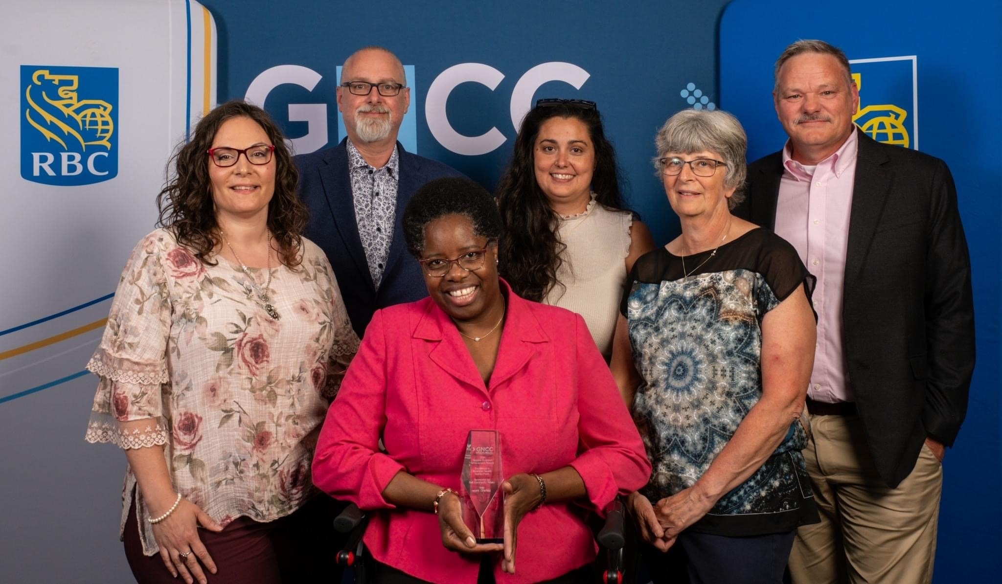 A team photo with some of The Hope Centre staff receiving an award for the 2024 Niagara Business Achievement Award