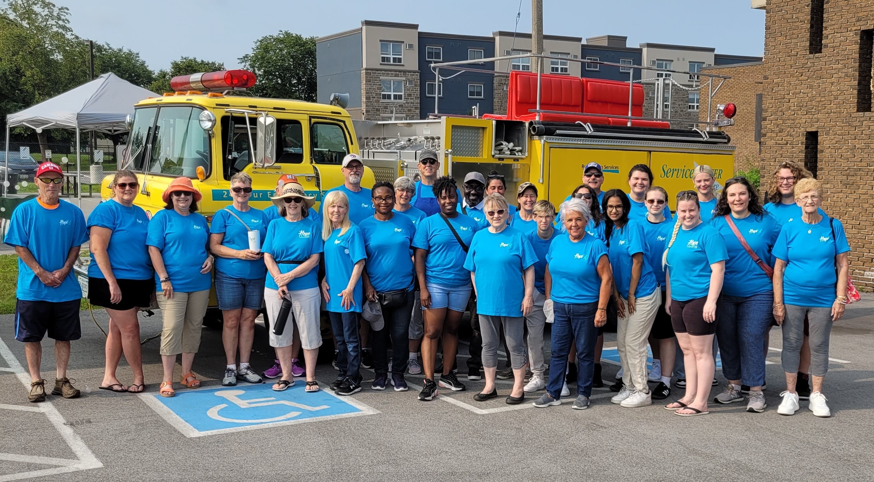 Group photo at the Welland Public Library with The Hope Centre banner