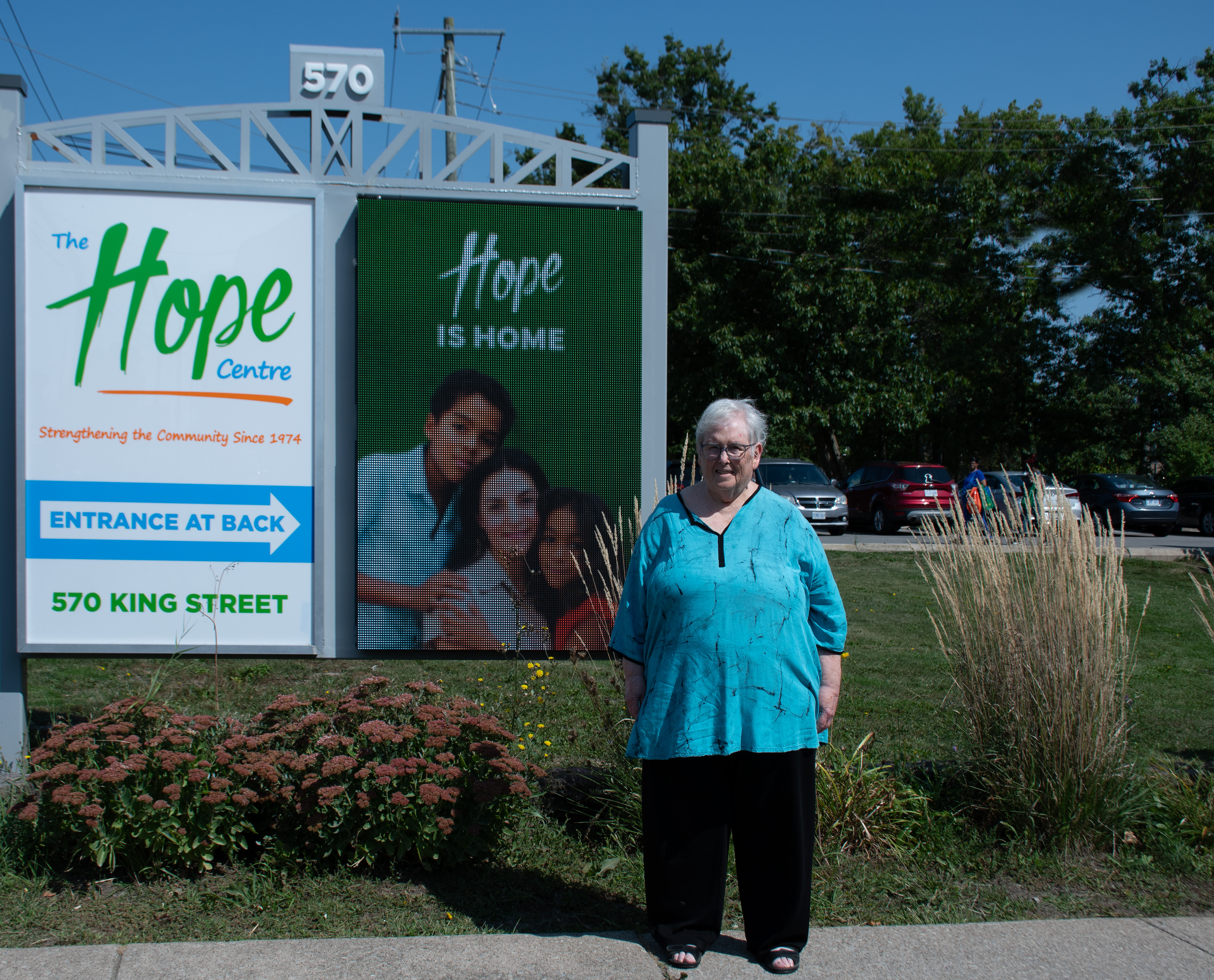 Group photo at the Welland Public Library with The Hope Centre banner